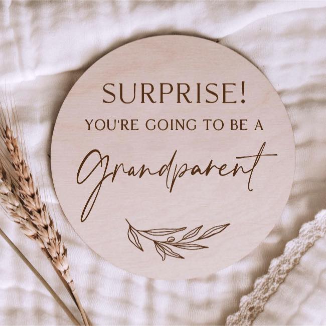 Announcement disc made of ply that says "Surprise! You're going to be a Grandparent".  Laser engraved onto plywood circle with an engraved twig design.  Available from Bubs and Bobbins.