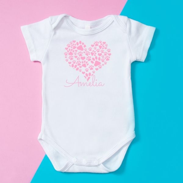 Baby Onesie with pink paw prints in a heart shape with baby name underneath heart.