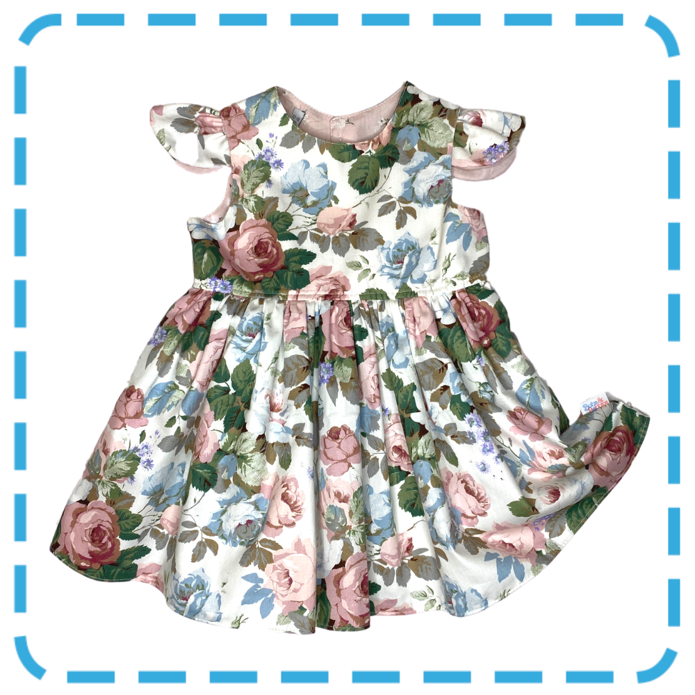 Bubs & Bobbins Amelia 4 in 1  baby and toddler dress in Dusky Rose print showing detachable flutters