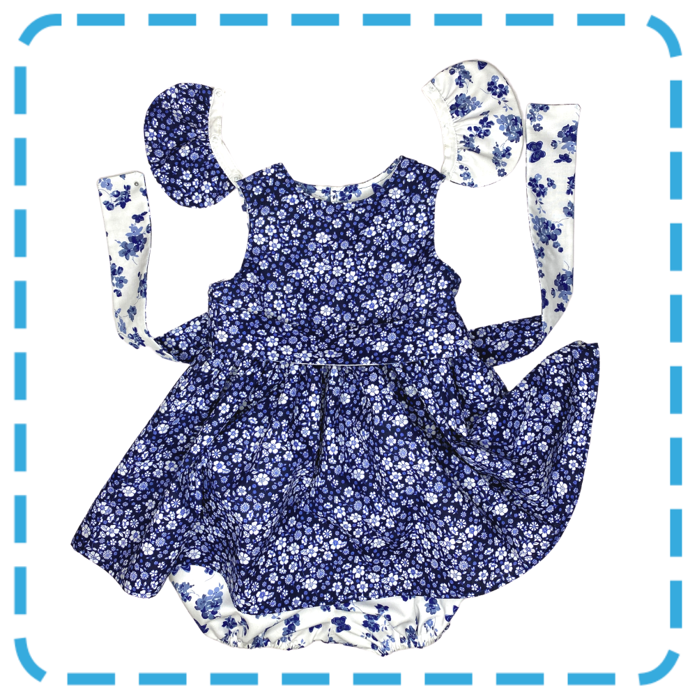 Bubs & Bobbins Amelia 4 in 1  baby and toddler dress in Indigo Floral print showing detachable waist sash and detachable flutters plus bloomers