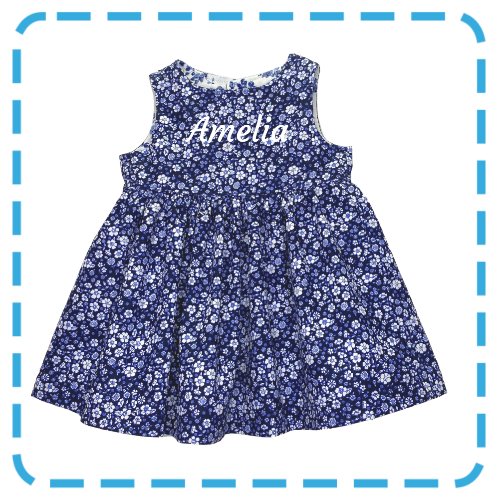 Amelia twirl dress - Indigo floral showing child's name in white flock transfer from Bubs & Bobbins